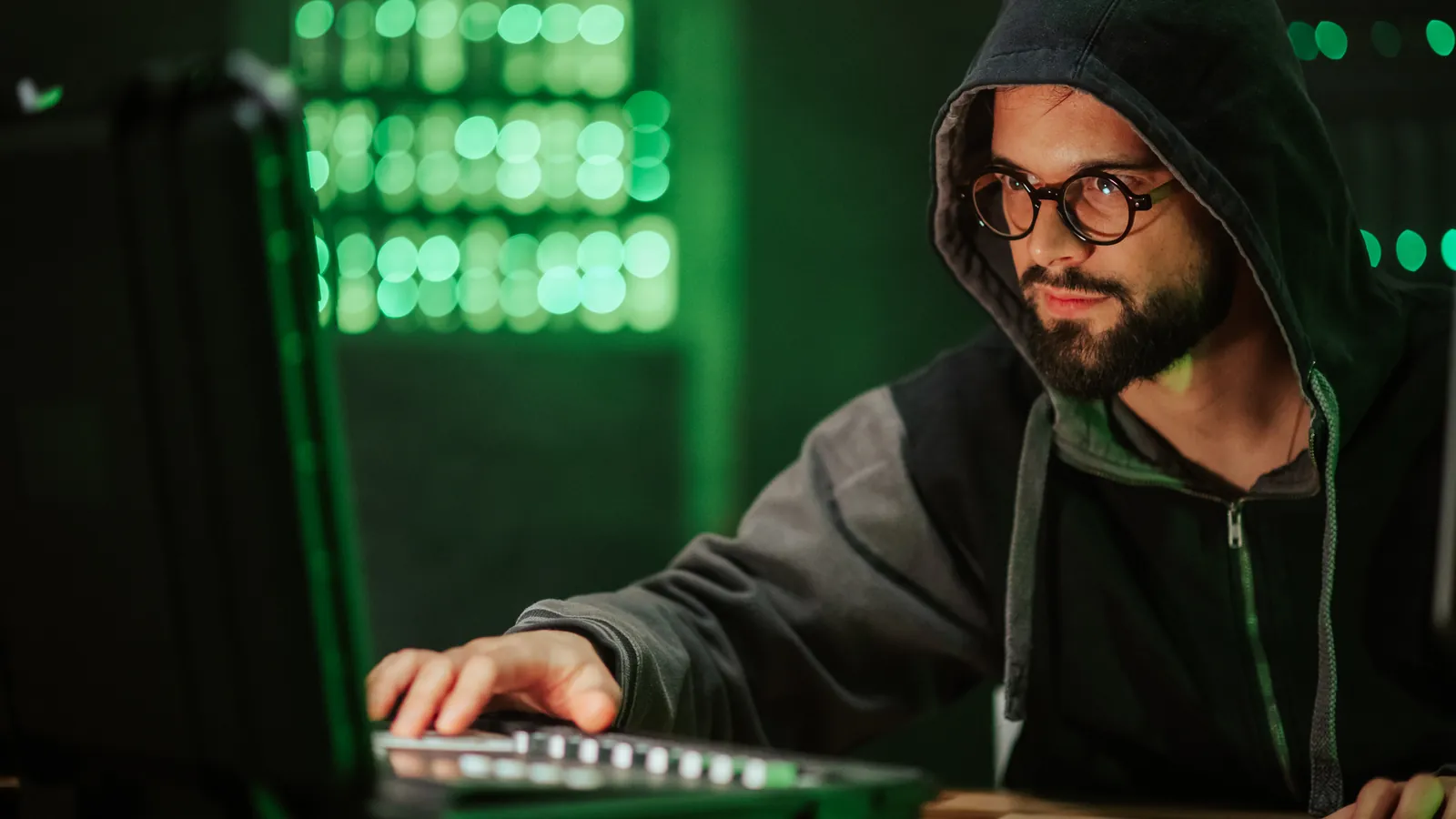 Ethical security professional testing systems from a laptop in a server room